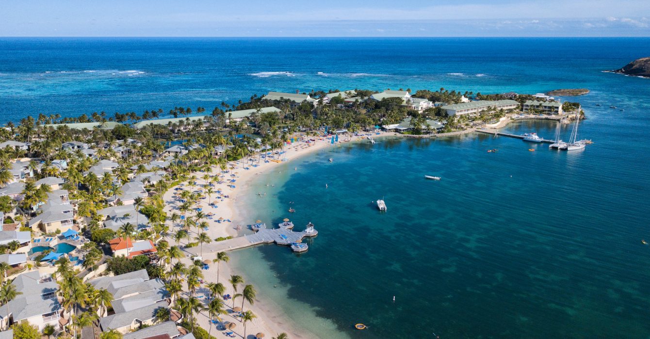 Aerial view of St James Club Antigua with the sea and sky every shade of perfect blue.