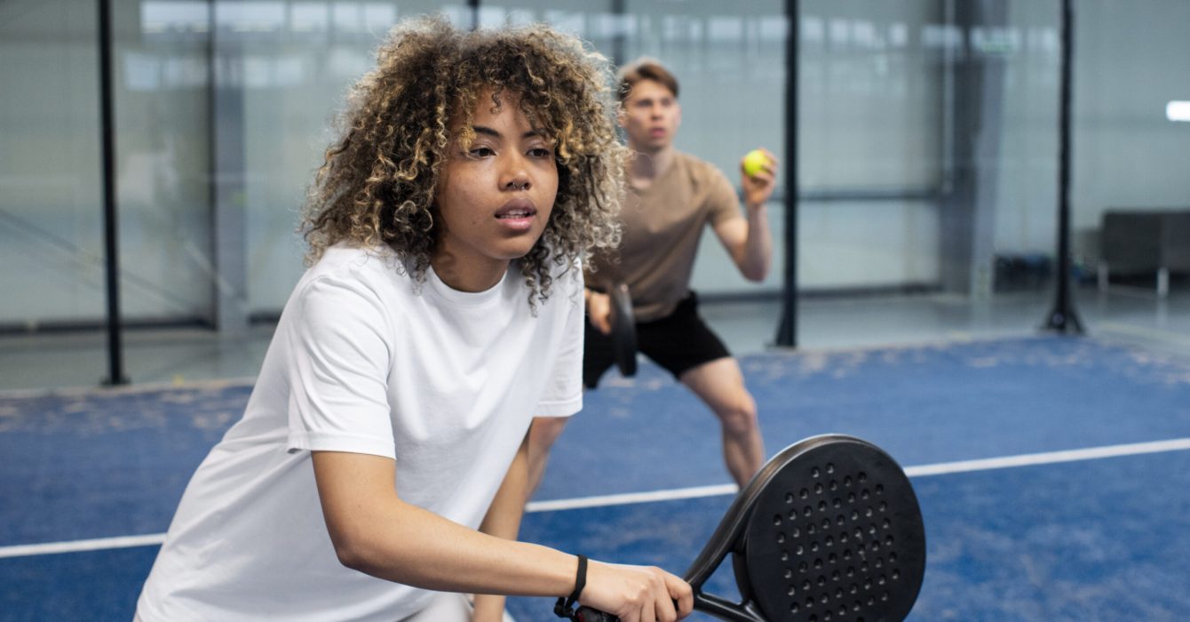 people-playing-paddle-tennis-inside