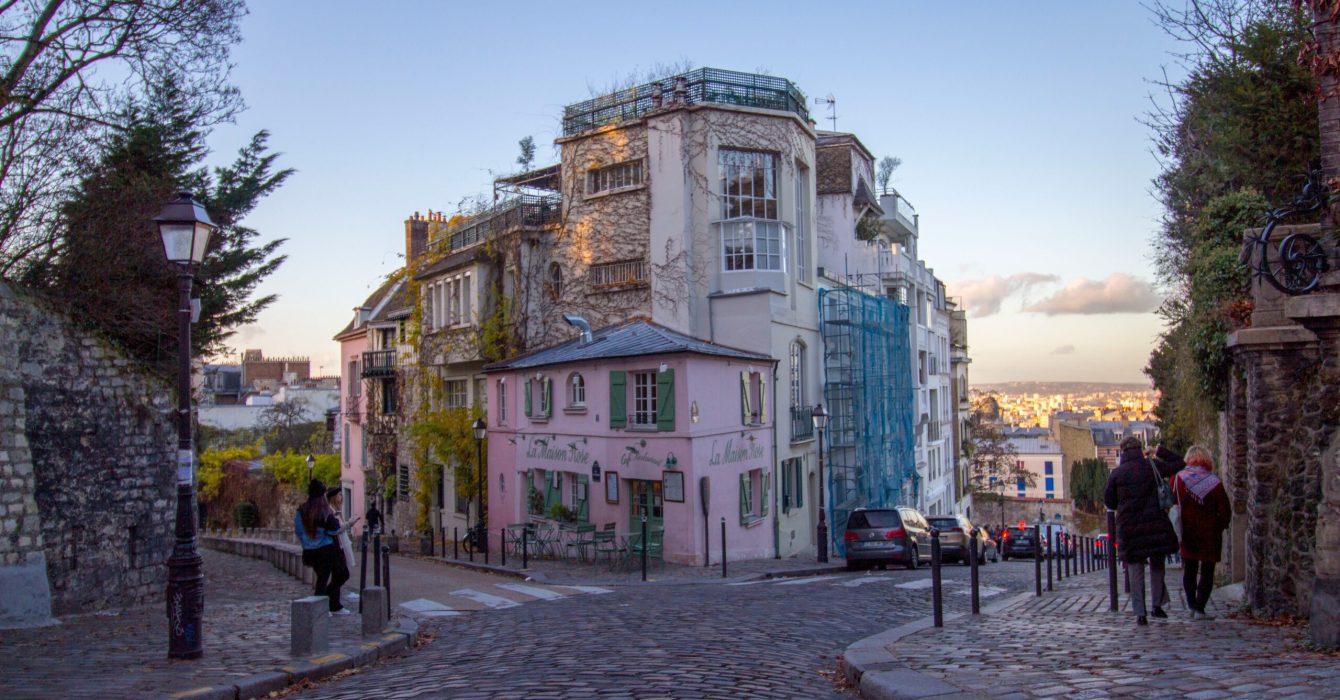 The picturesque pink maisonette restaurant, La Maison Rose, serves traditional French cuisine in Paris France.